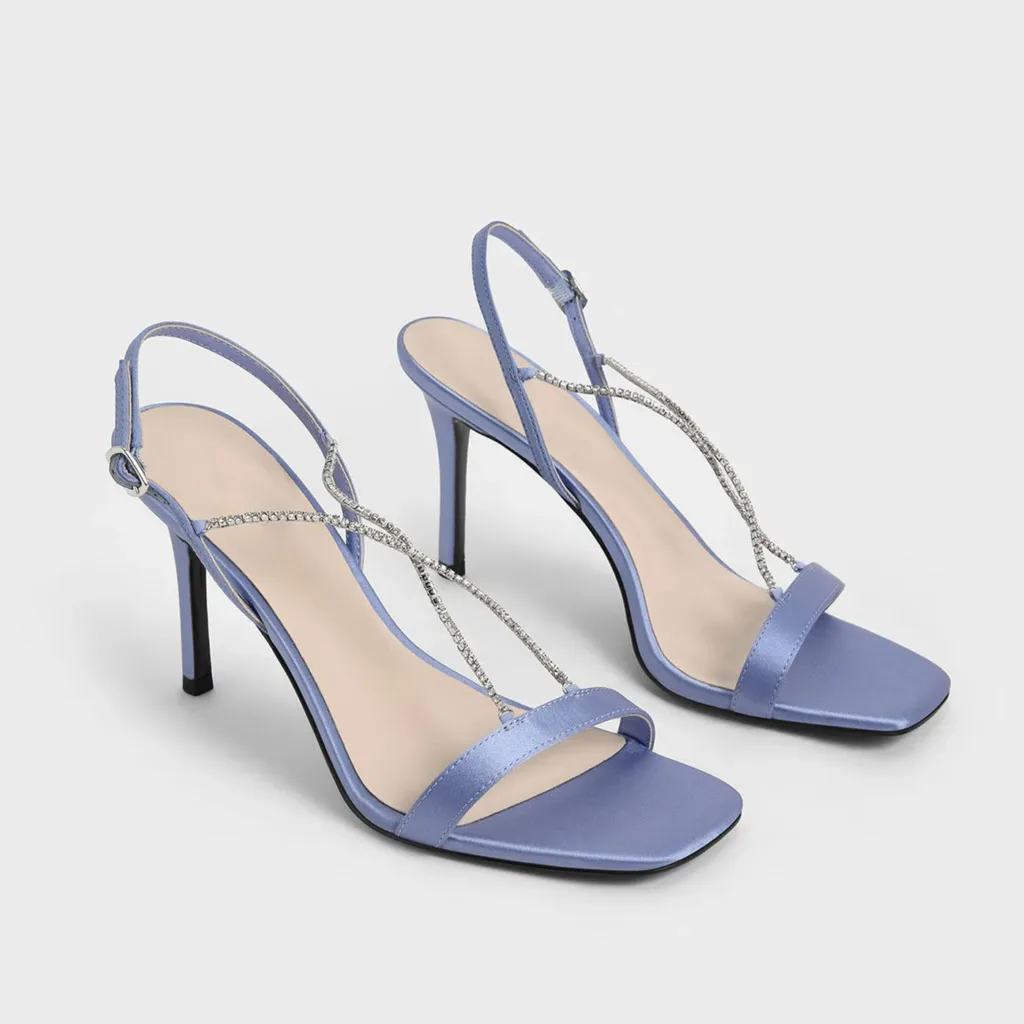 Purple satin sandals with strappy design and silver rhinestone embellishments by Lajwanti Designers.