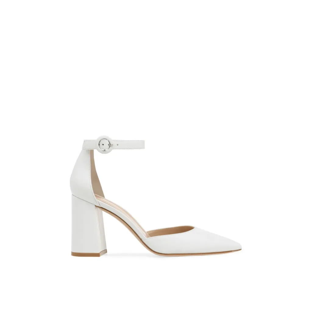 Elegant white private label pumps with ankle strap by Lajwanti Designers, featuring a chic block heel design.